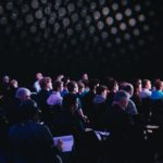 Crowd of people at a conference.