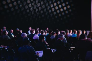Crowd of people at a conference.